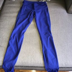worn, royal blue lululemon tights